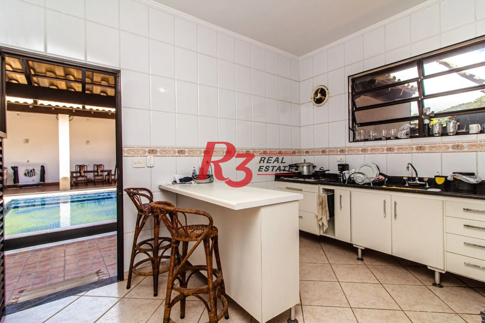 Casa com 4 dormitórios à venda, 360m² útil, R$ 1.250.000 - Praia do Tombo - Guarujá/SP