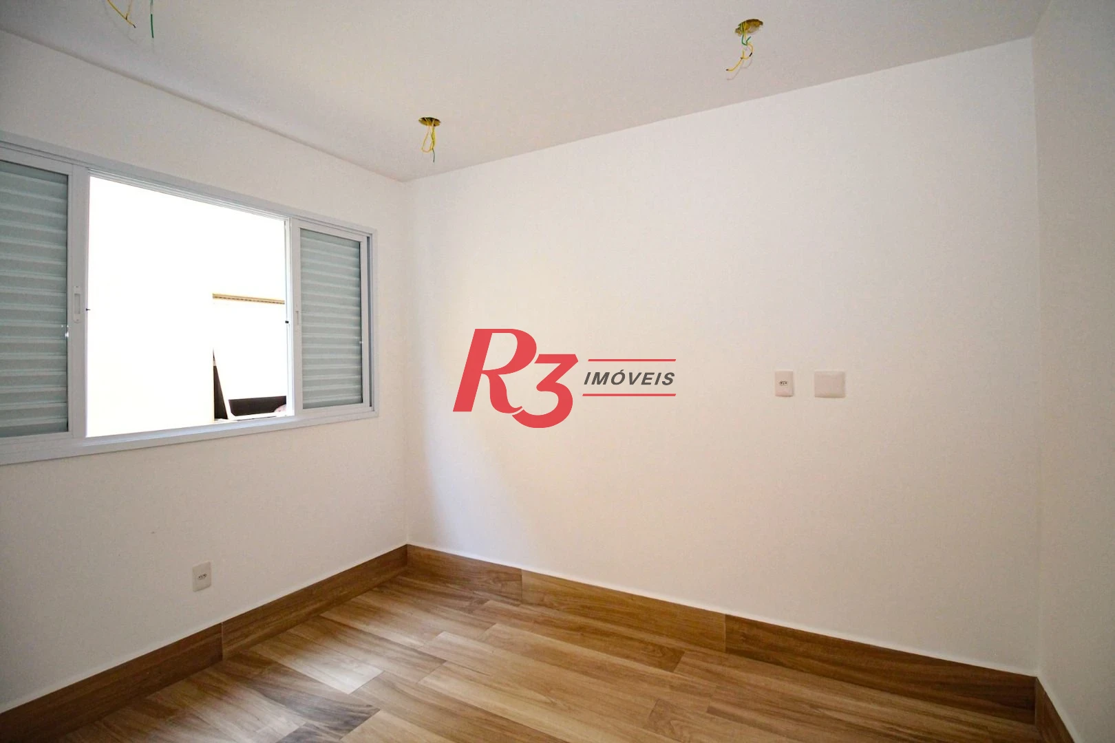 Sobrado com 3 dormitórios à venda, 190 m² por R$ 800.000,00 - Gonzaga - Santos/SP