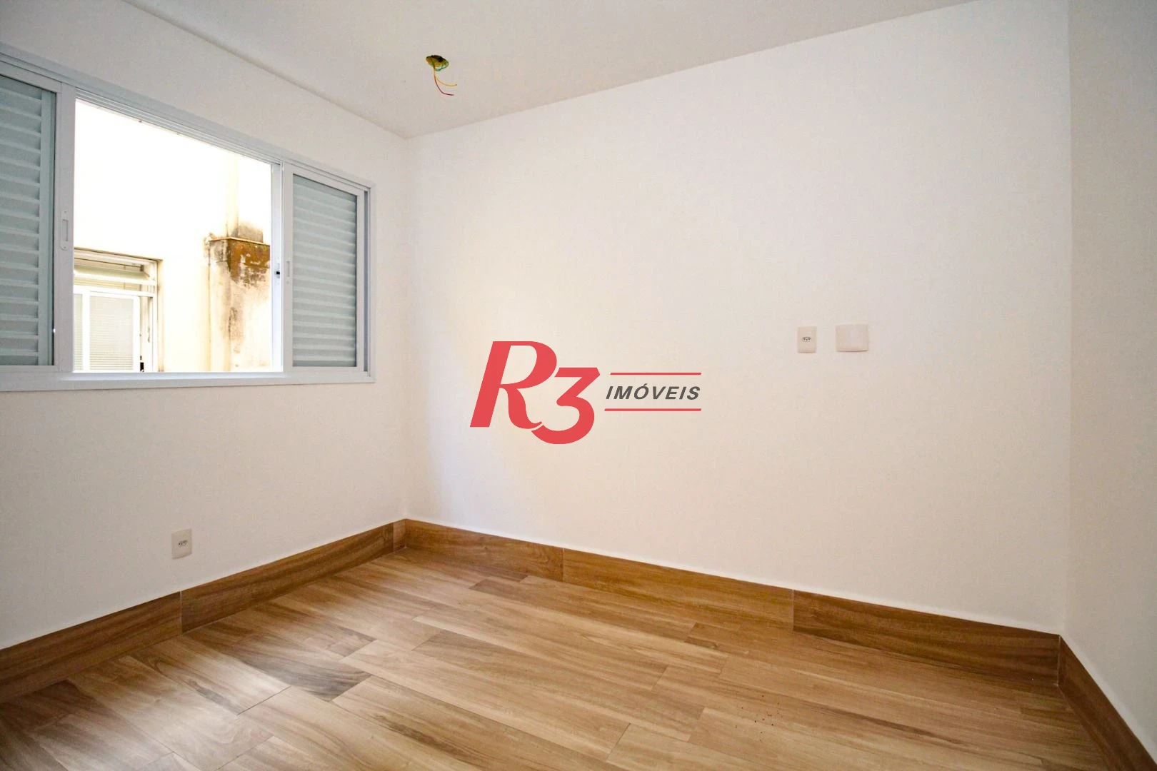 Sobrado com 3 dormitórios à venda, 190 m² por R$ 1.050.000,00 - Gonzaga - Santos/SP