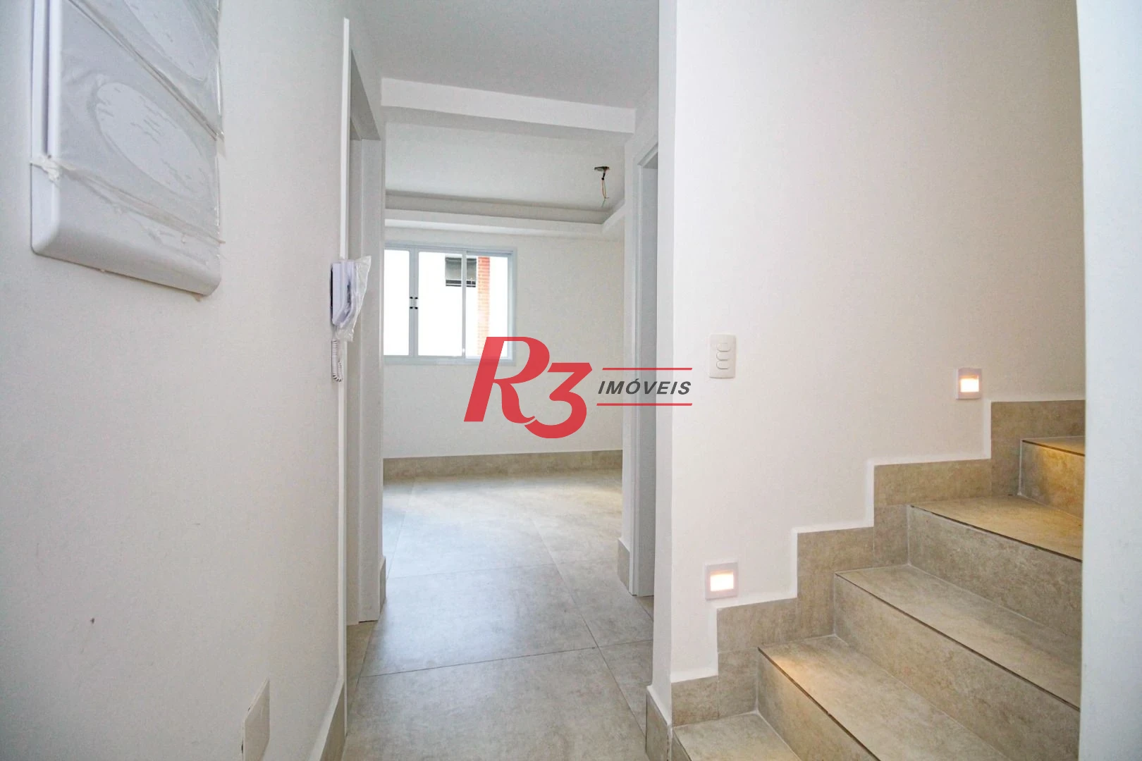 Sobrado com 3 dormitórios à venda, 190 m² por R$ 1.050.000,00 - Gonzaga - Santos/SP