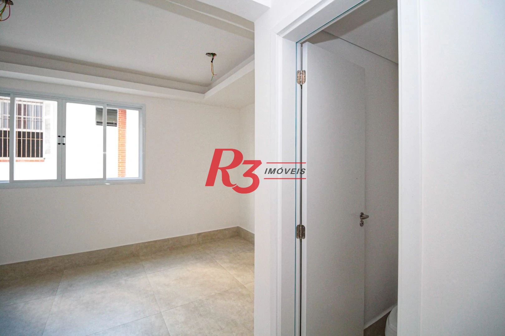 Sobrado com 3 dormitórios à venda, 190 m² por R$ 1.050.000,00 - Gonzaga - Santos/SP