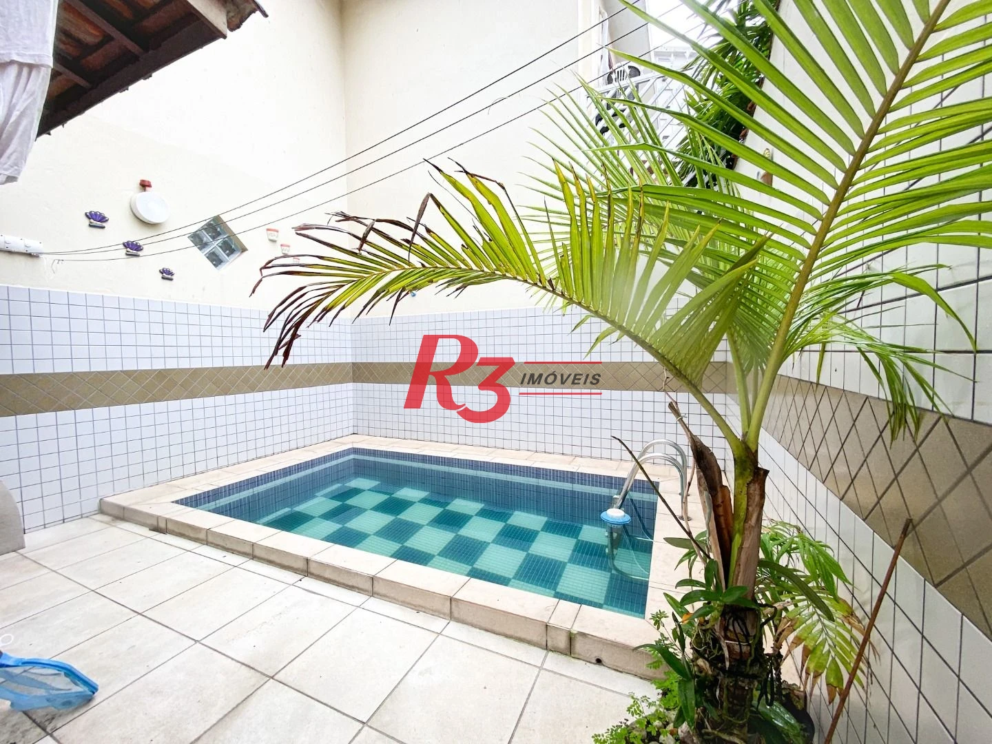 Sobrado com 3 dormitórios à venda, 130 m² por R$ 980.000 no José Menino - Santos/SP