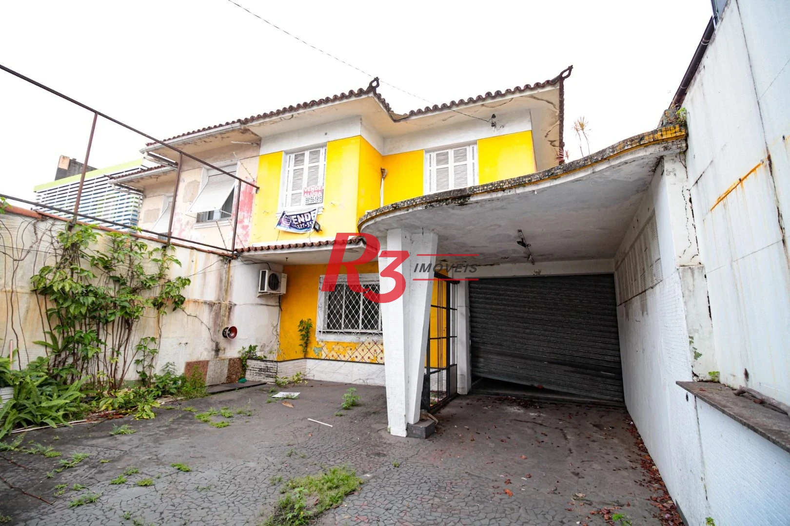 Sobrado com 3 dormitórios à venda, 300 m² por R$ 1.280.000,00 - Embaré - Santos/SP