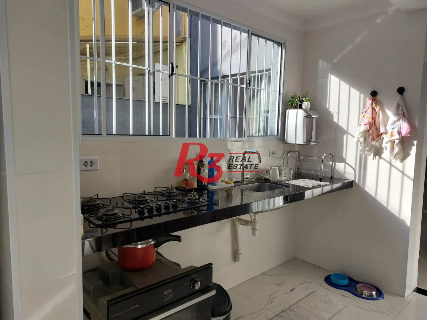 Sobrado com 3 dormitórios à venda, 200 m² por R$ 1.390.000,00 - Embaré - Santos/SP