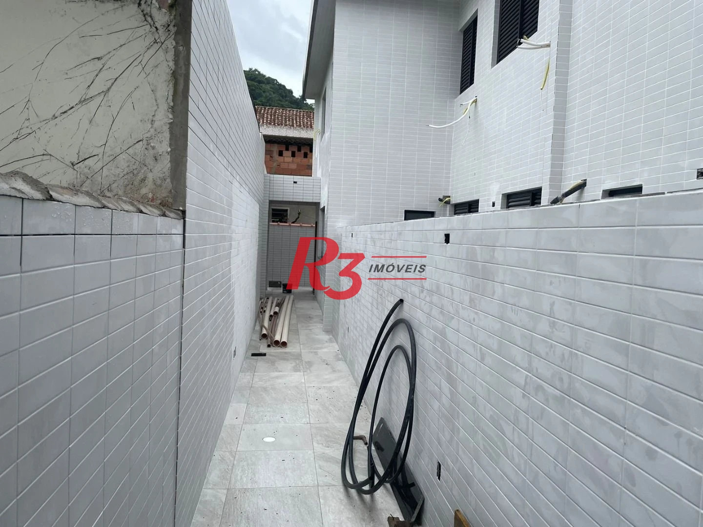 Sobrado fundos com 3 dormitórios, 1 suíte à venda, 152 m² por R$ 846.000 - Vila Belmiro - Santos/SP