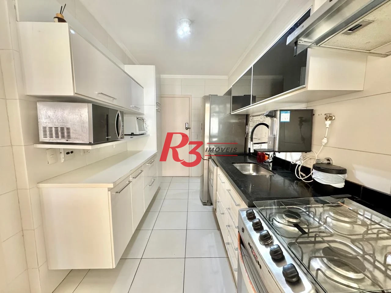 Apartamento com 2 dormitórios à venda, 108 m² por R$ 1.600.000,00 - Gonzaga - Santos/SP