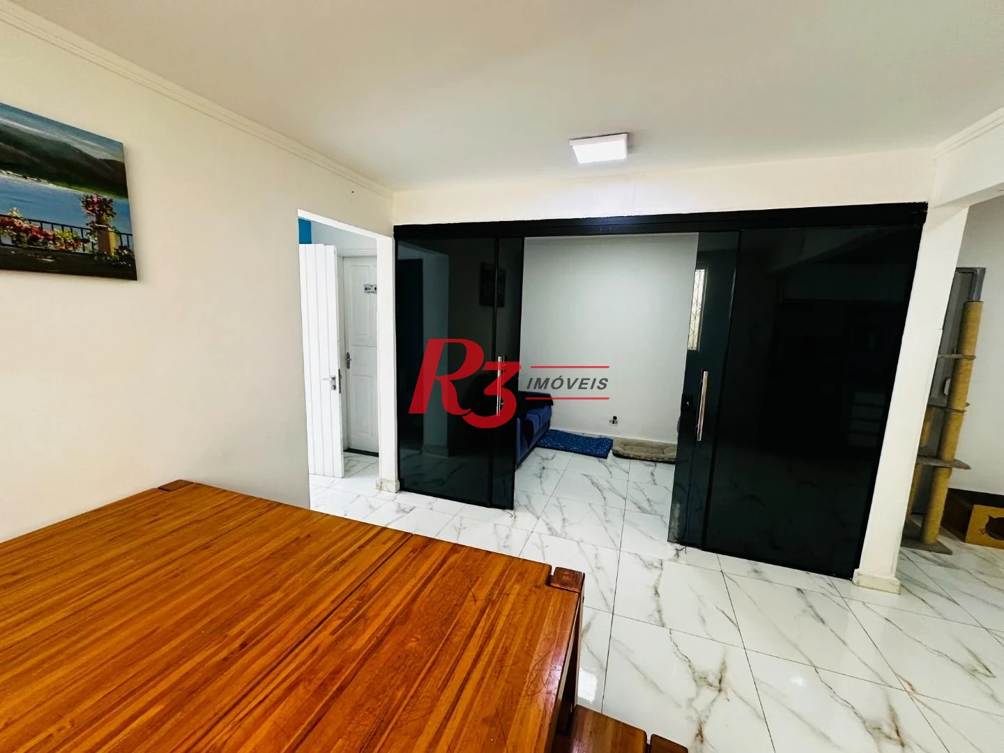 Sobrado com 4 dormitórios à venda, 245 m² por R$ 1.350.000,00 - Ponta da Praia - Santos/SP