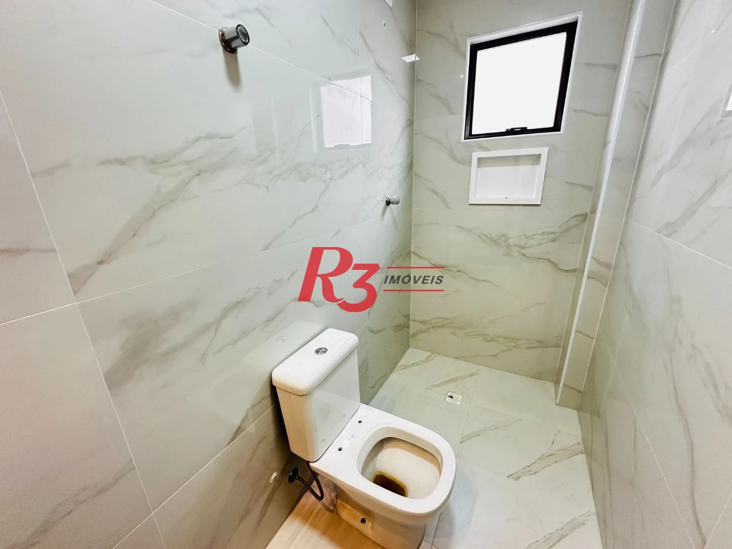 Sobrado com 3 dormitórios à venda, 220 m² por R$ 1.600.000,00 - Embaré - Santos/SP