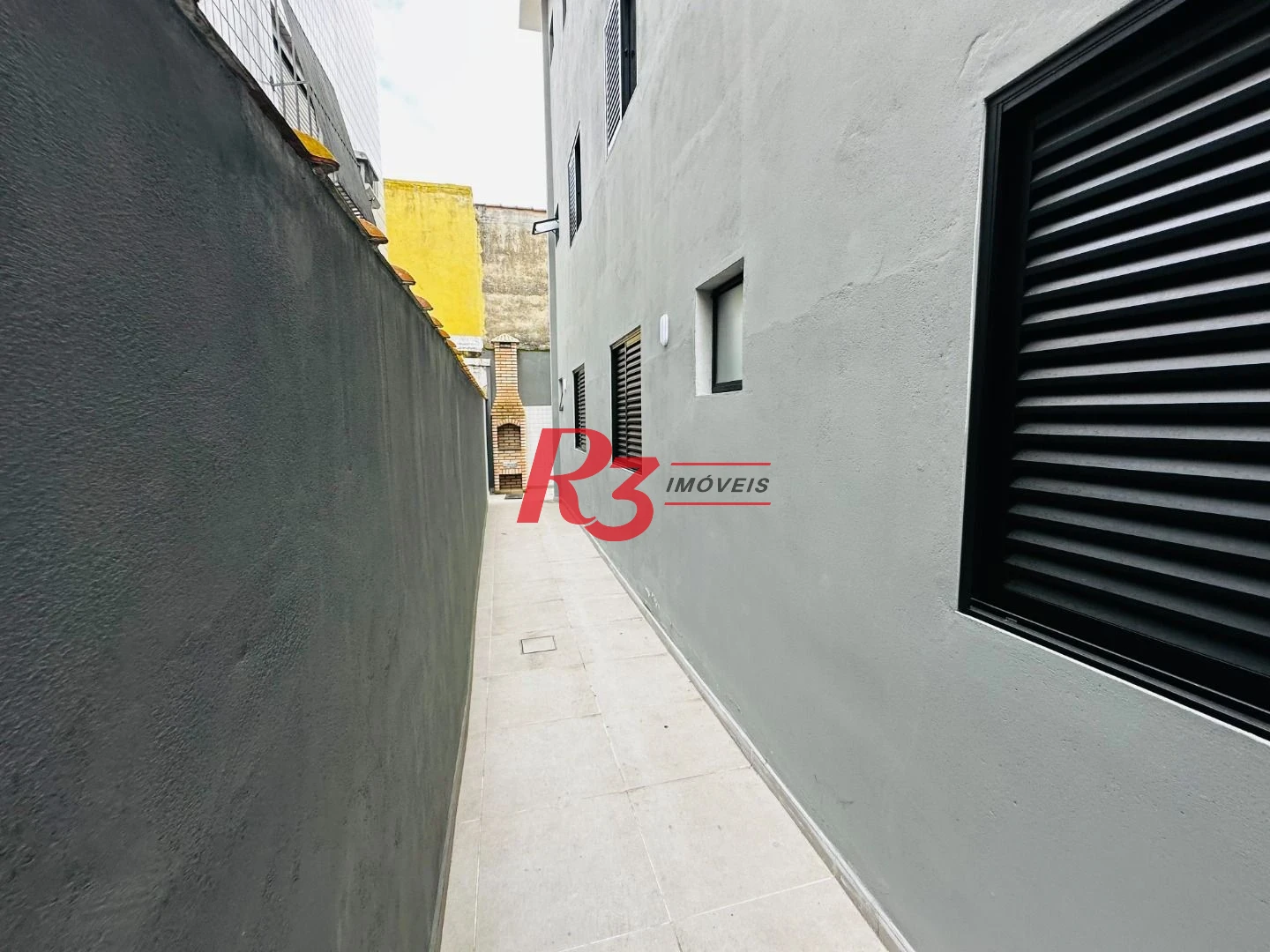 Sobrado com 3 dormitórios à venda, 160 m² por R$ 950.000,00 - Embaré - Santos/SP