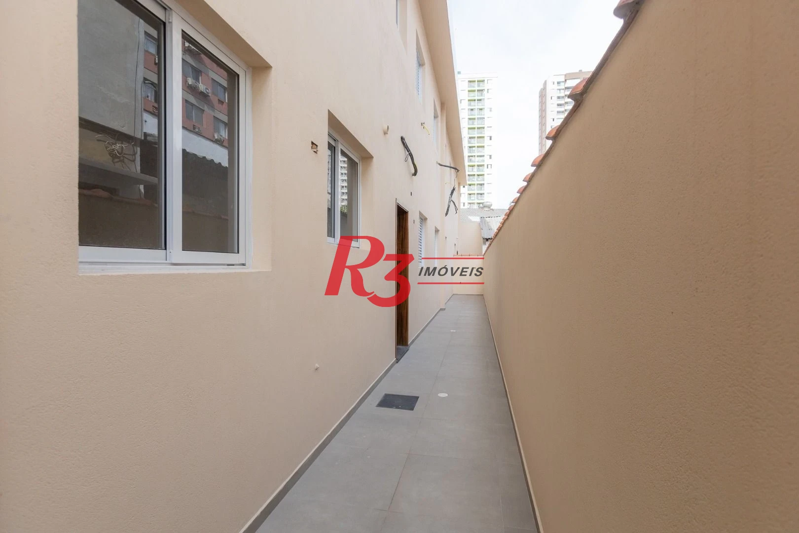 Casa com 3 dormitórios à venda, 104 m² por R$ 950.000,00 - Encruzilhada - Santos/SP
