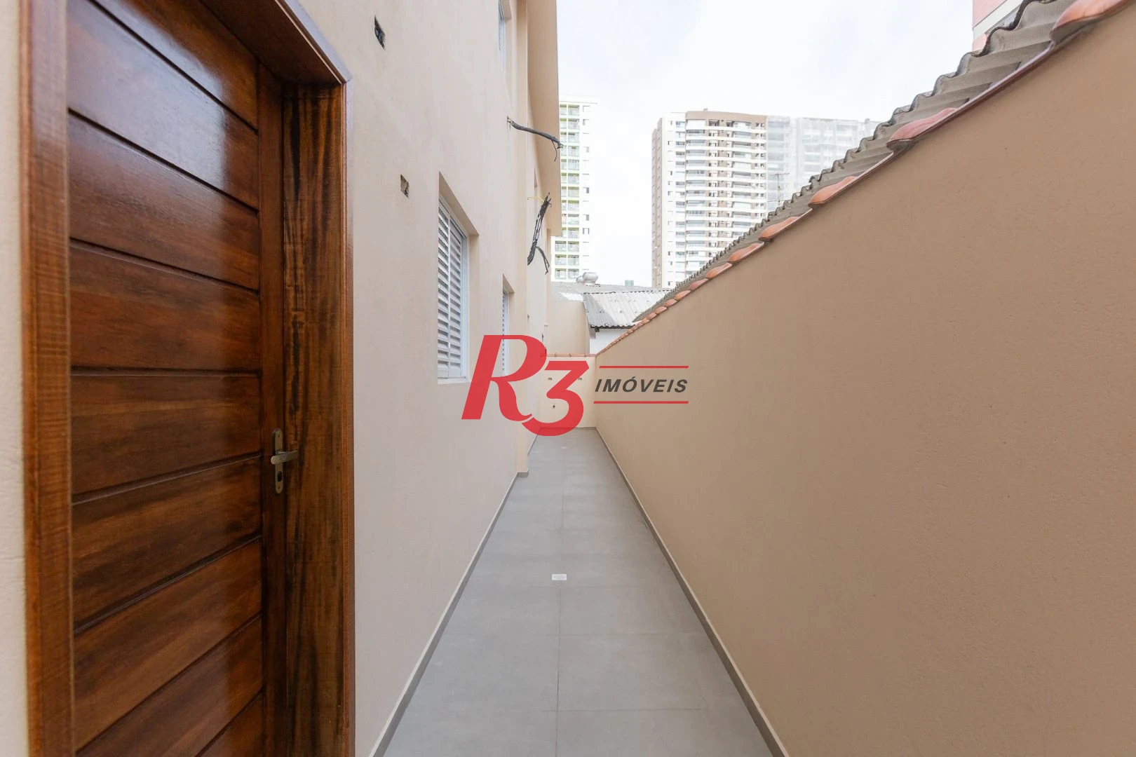 Casa com 3 dormitórios à venda, 104 m² por R$ 950.000,00 - Encruzilhada - Santos/SP