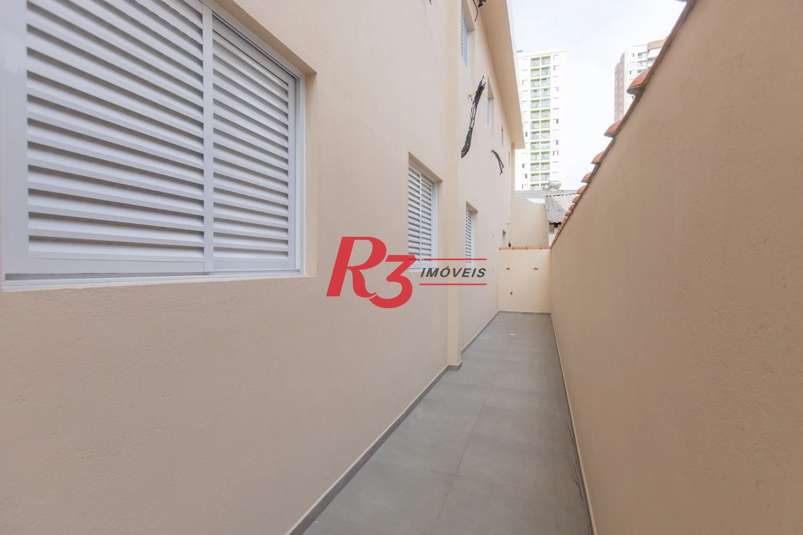 Casa com 3 dormitórios à venda, 104 m² por R$ 950.000,00 - Encruzilhada - Santos/SP