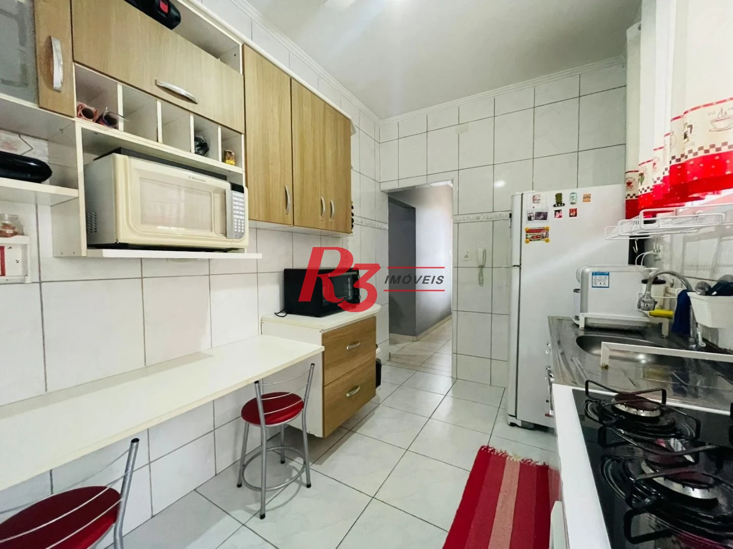 Apartamento com 2 dormitórios à venda, 62 m² por R$ 490.000,00 - Gonzaga - Santos/SP