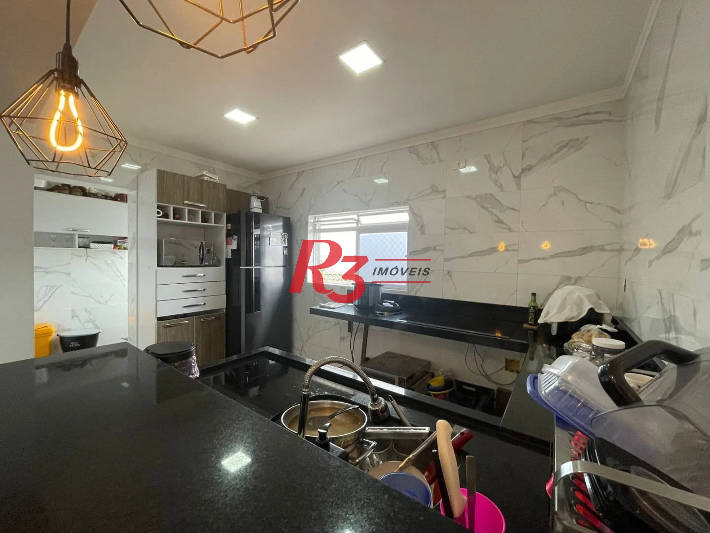 Casa com 3 dormitórios à venda, 117 m² por R$ 950.000,00 - Estuário - Santos/SP