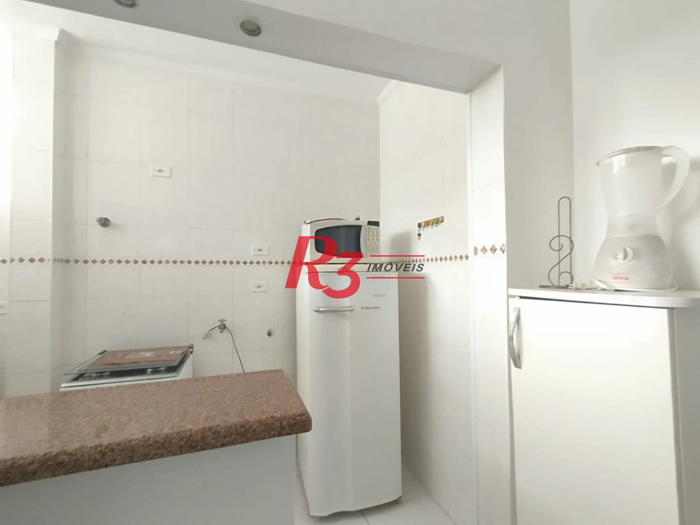 Apartamento com 2 dormitórios à venda, 55 m² por R$ 351.000,00 - Gonzaga - Santos/SP