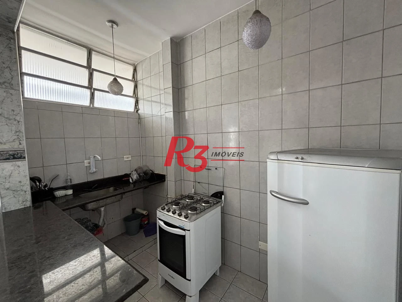 Apartamento com 2 dormitórios frente praia à venda, 55 m² por R$ 352.000 - Gonzaga - Santos/SP