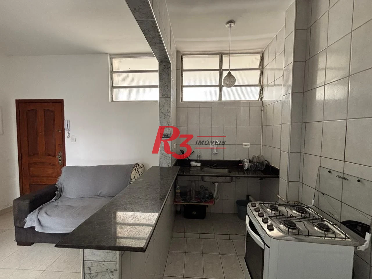 Apartamento com 2 dormitórios frente praia à venda, 55 m² por R$ 352.000 - Gonzaga - Santos/SP