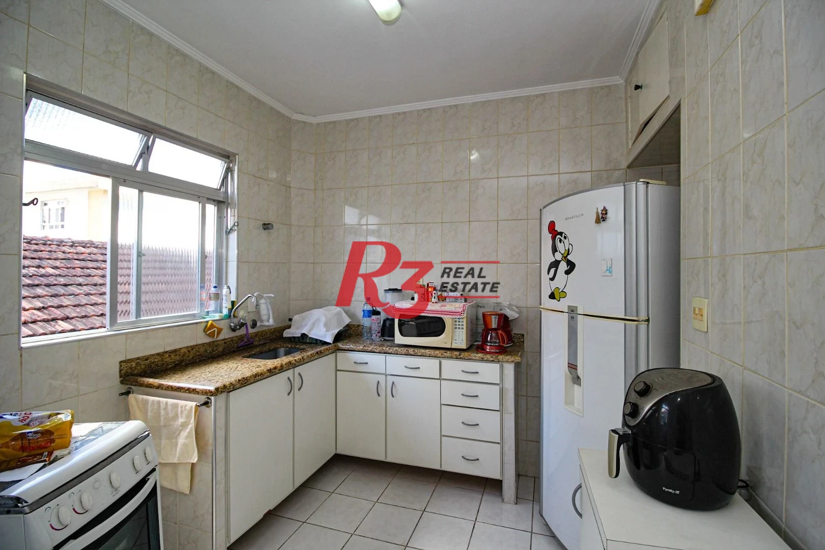 Apartamento com 2 dormitórios à venda, 60 m² por R$ 385.000,00 - Gonzaga - Santos/SP