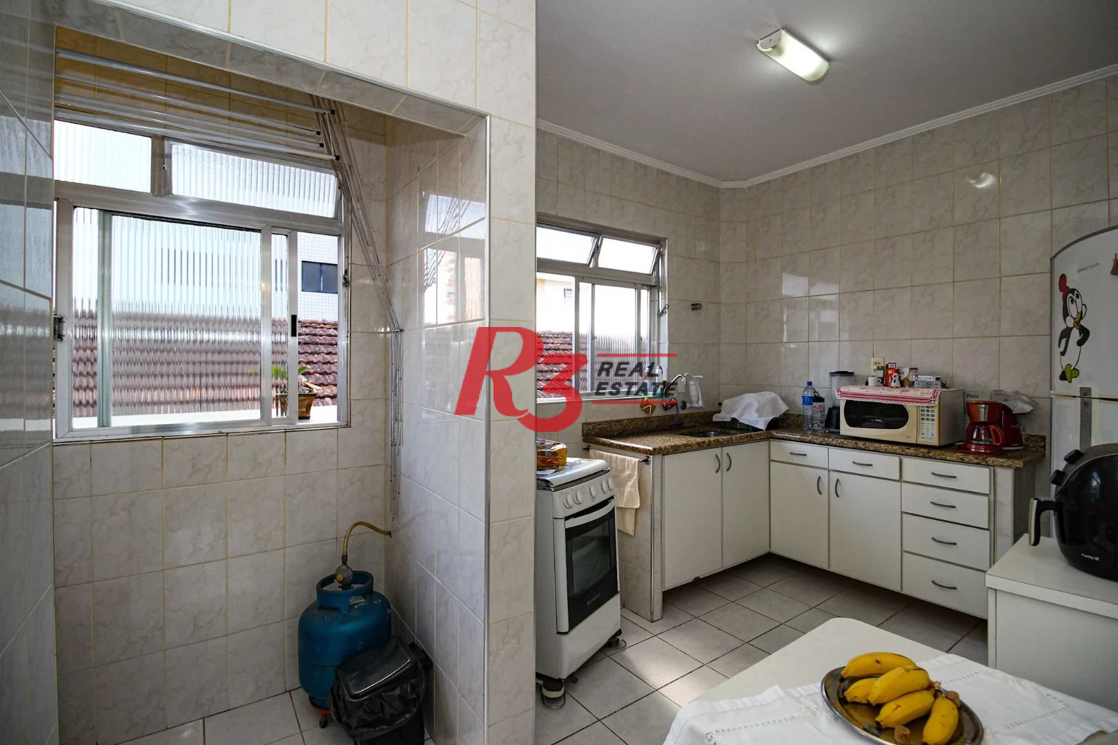 Apartamento com 2 dormitórios à venda, 60 m² por R$ 385.000,00 - Gonzaga - Santos/SP