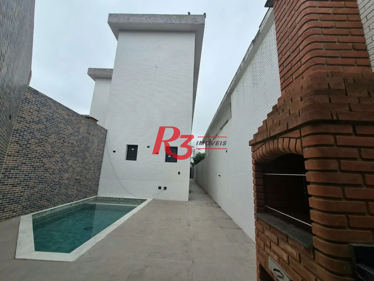 Casa com 3 dormitórios à venda, 100 m² por R$ 1.365.000,00 - Embaré - Santos/SP