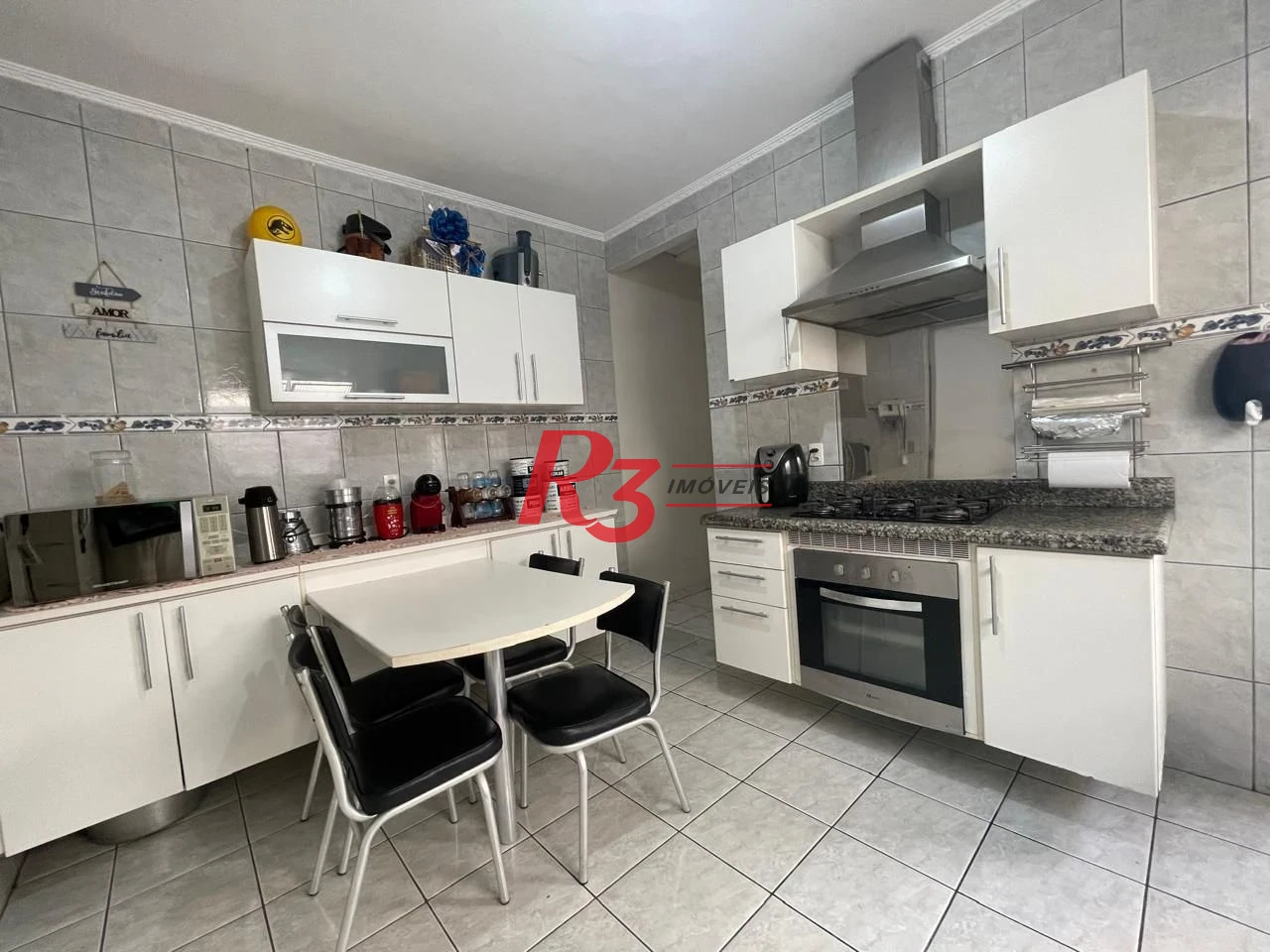 Casa com 3 dormitórios à venda, 111 m² por R$ 690.000,00 - Marapé - Santos/SP