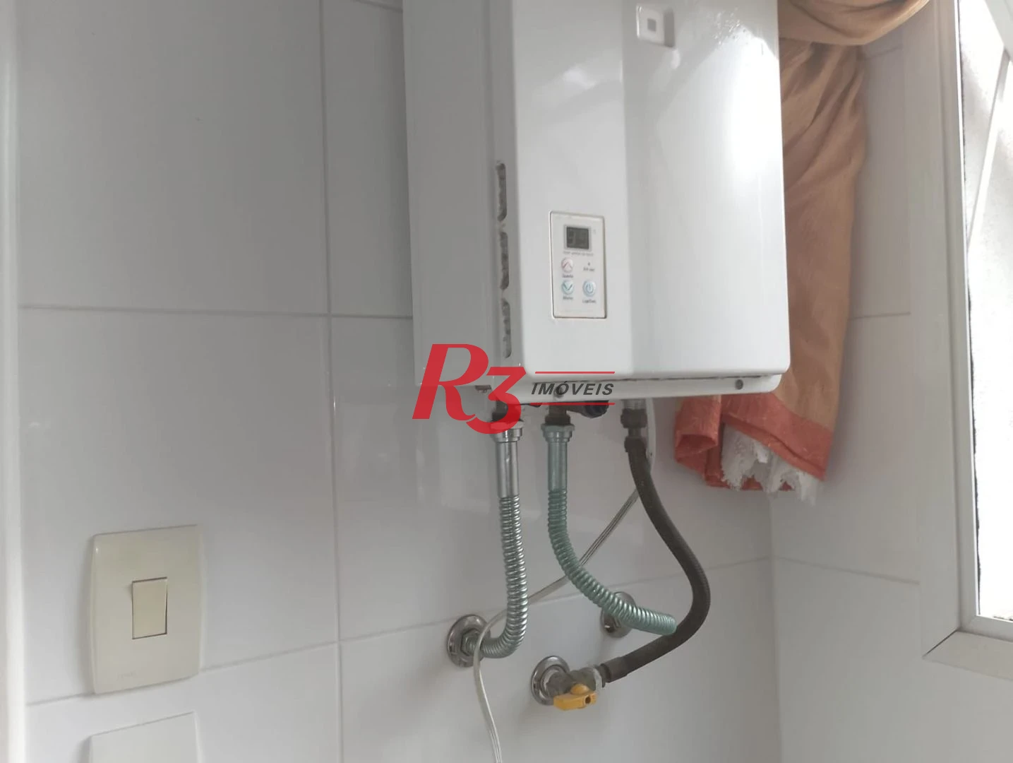 Sobrado com 3 dormitórios à venda, 180 m² por R$ 2.100.000,00 - Gonzaga - Santos/SP