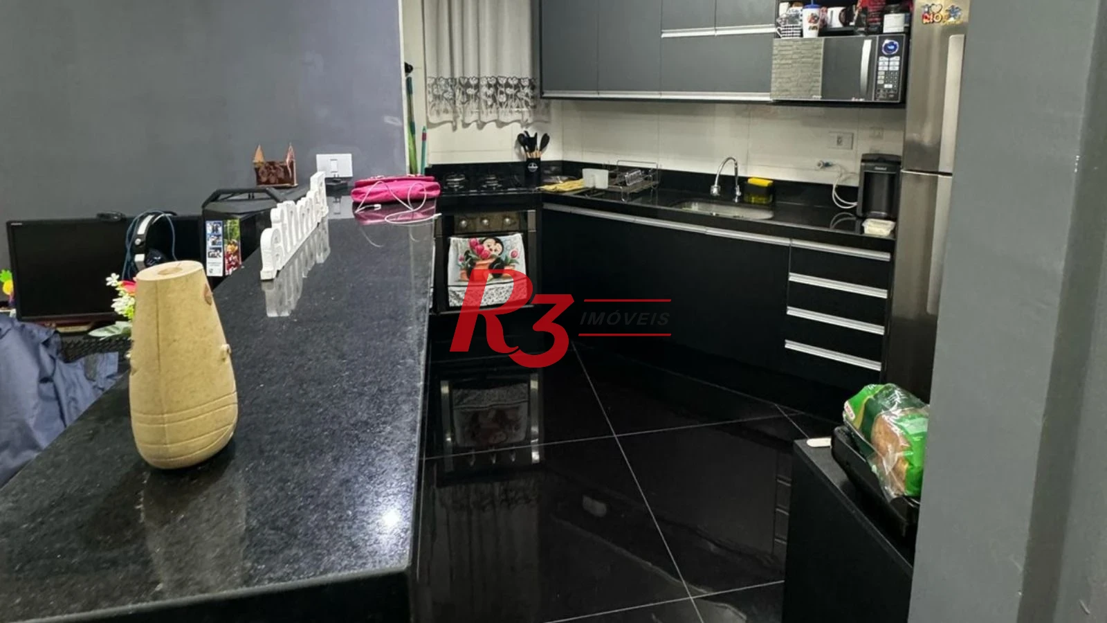 Apartamento com 2 dormitórios à venda, 70 m² por R$ 300.000,00 - Saboó - Santos/SP