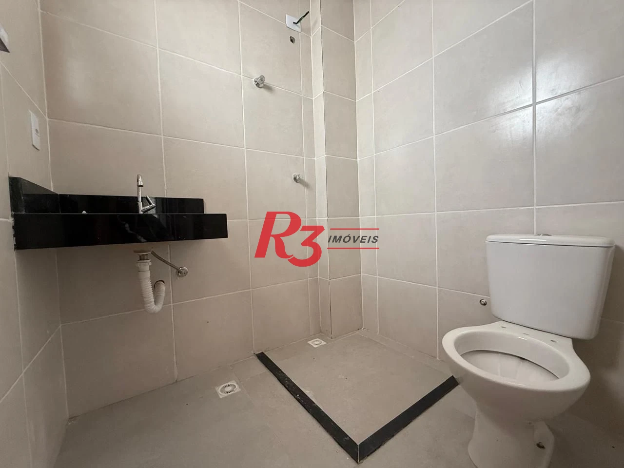 Casa com 3 dormitórios à venda, 135 m² por R$ 600.000,00 - Estuário - Santos/SP