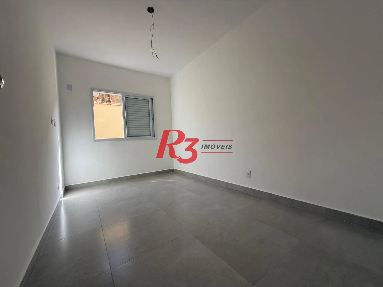Casa com 3 dormitórios à venda, 134 m² por R$ 600.000,00 - Estuário - Santos/SP