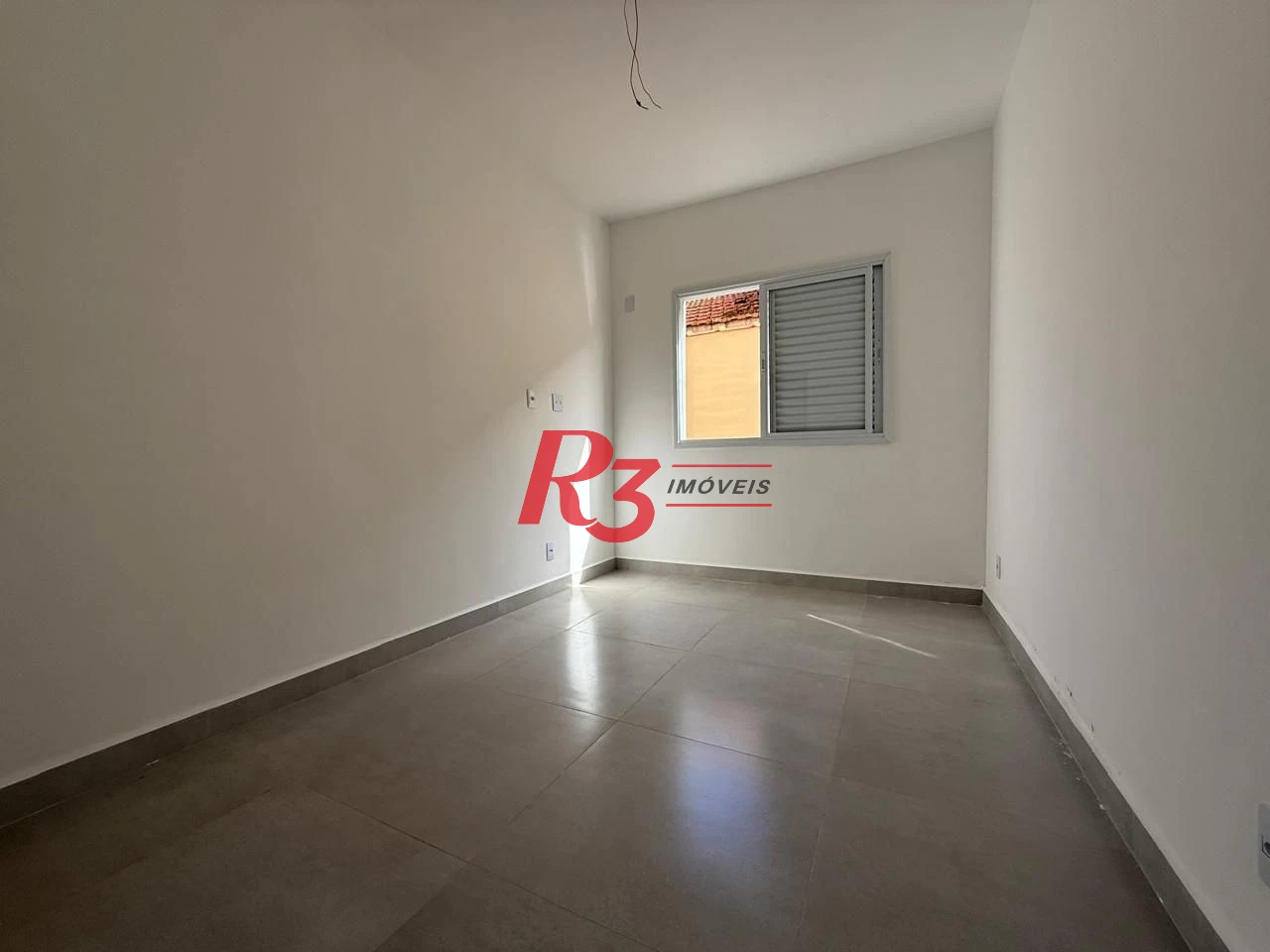 Casa com 3 dormitórios à venda, 134 m² por R$ 600.000,00 - Estuário - Santos/SP