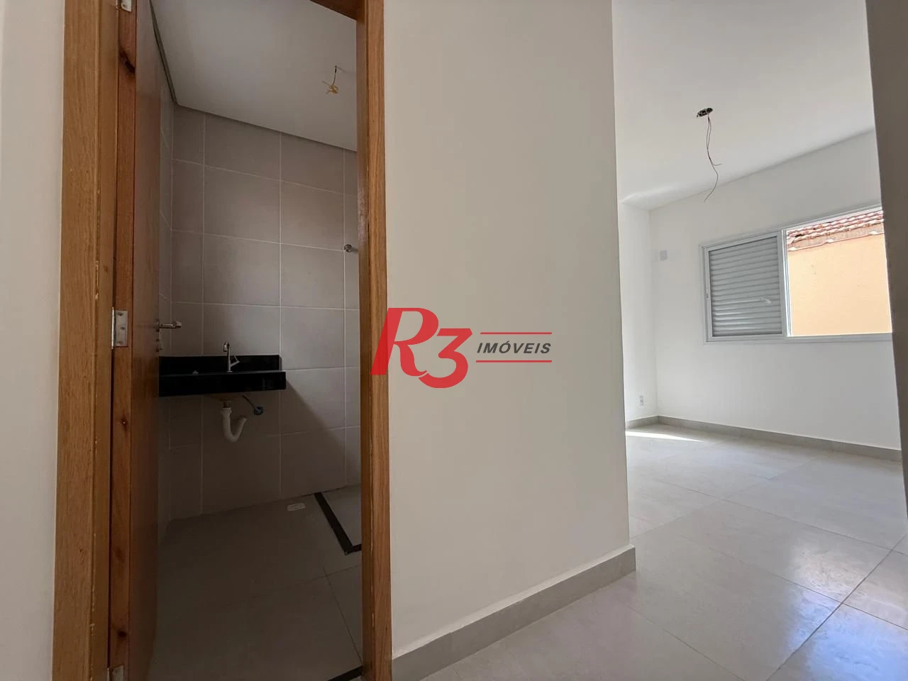 Casa com 3 dormitórios à venda, 134 m² por R$ 600.000,00 - Estuário - Santos/SP