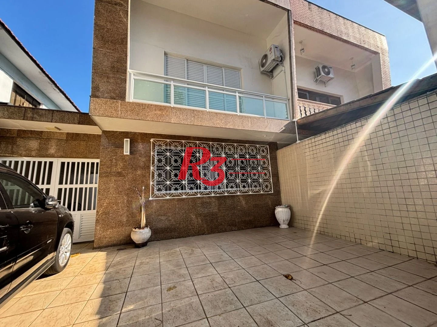 Sobrado com 3 dormitórios à venda, 187 m² por R$ 2.100.000,00 - Ponta da Praia - Santos/SP