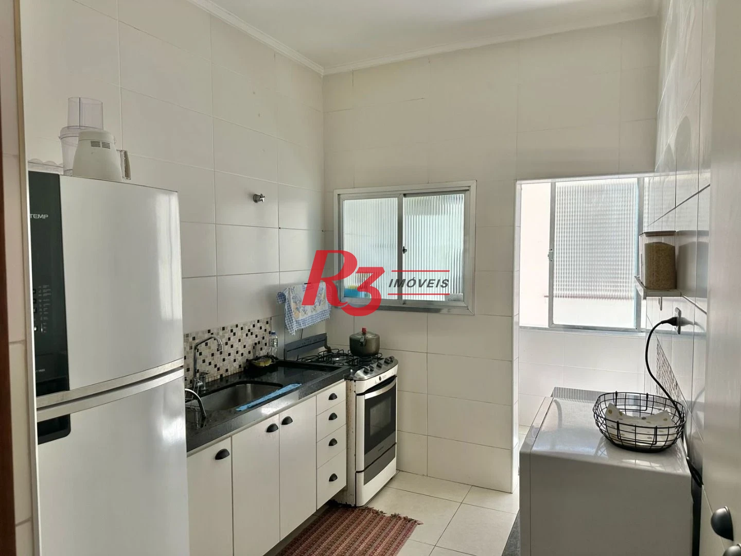 Casa com 3 dormitórios à venda, 100 m² por R$ 600.000,00 - Embaré - Santos/SP