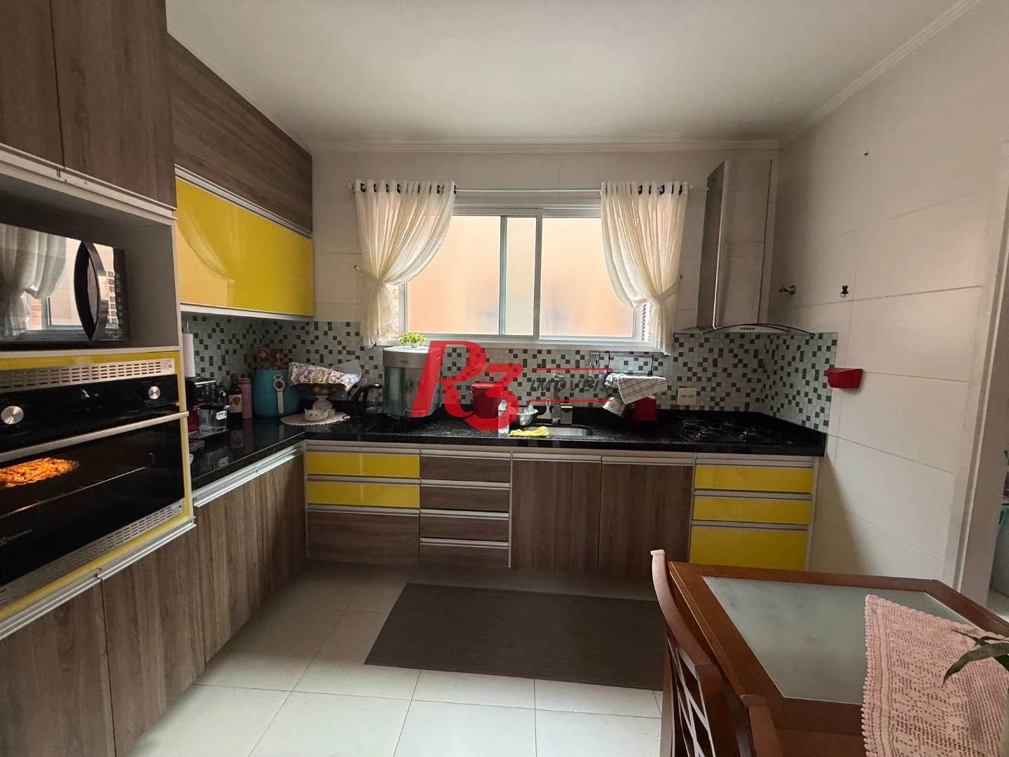 Village com 2 dormitórios à venda, 104 m² por R$ 590.000,00 - Vila Mathias - Santos/SP