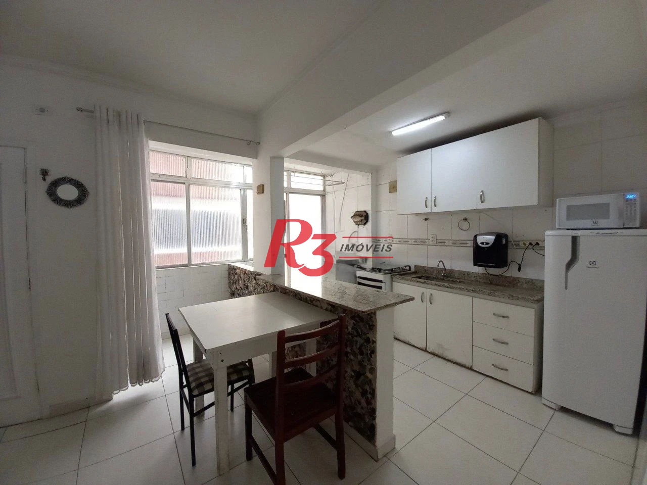 Apartamento com 2 dormitórios à venda, 60 m² por R$ 450.000,00 - Gonzaga - Santos/SP