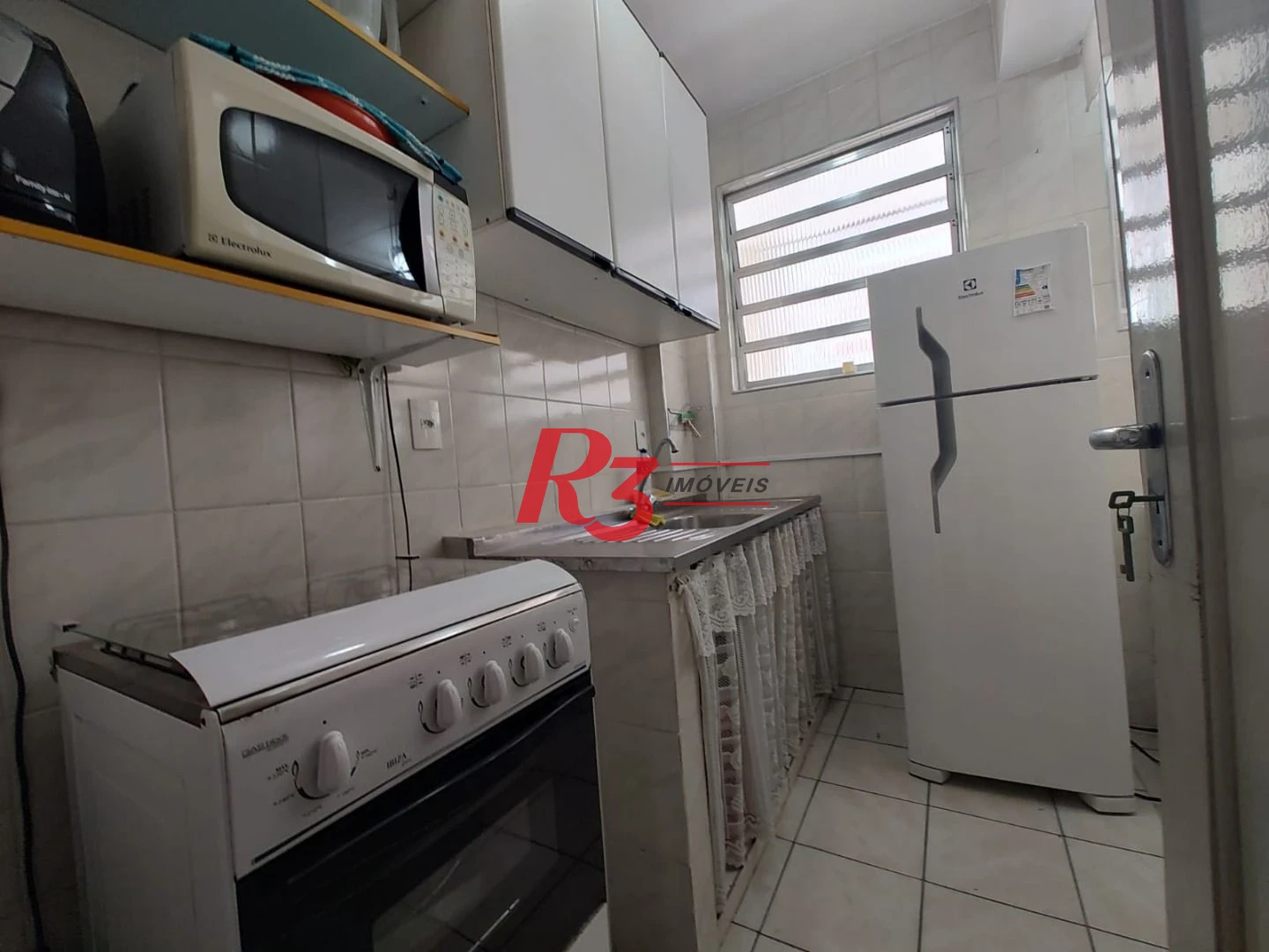 Apartamento com 2 dormitórios à venda, 60 m² por R$ 440.000,00 - Gonzaga - Santos/SP
