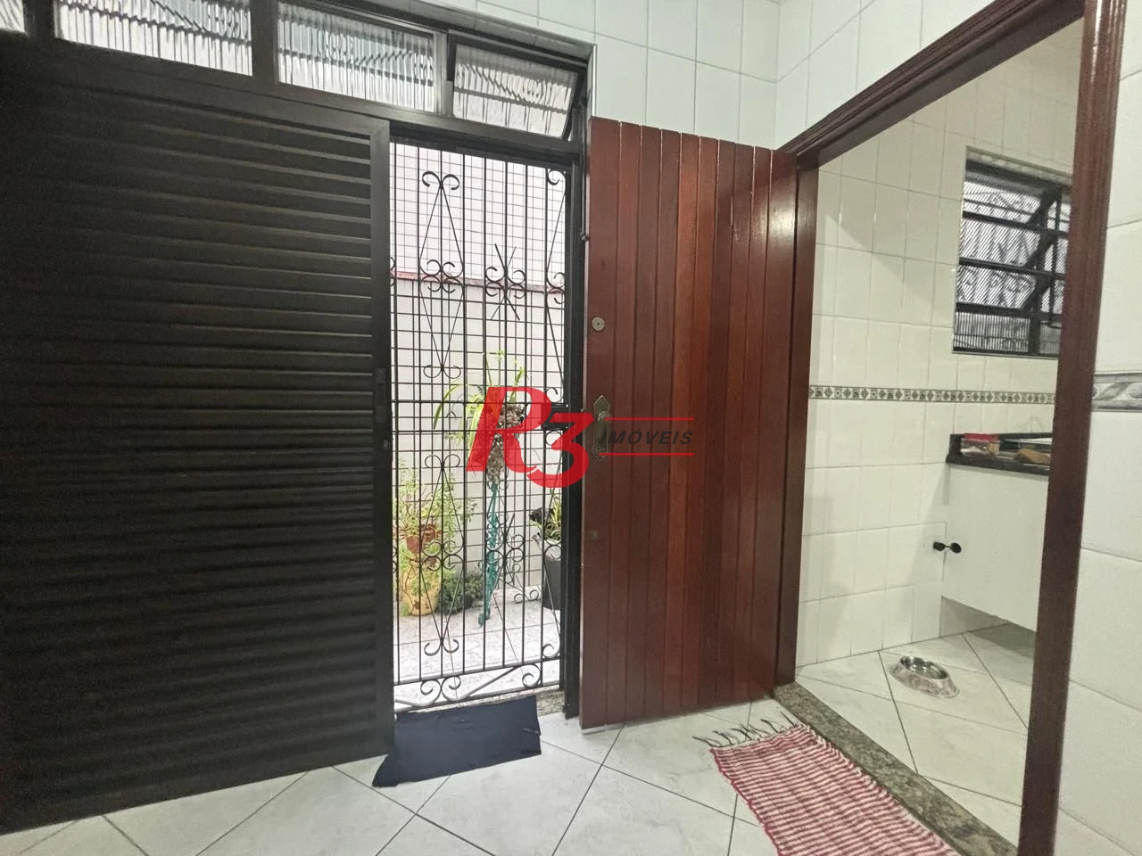 Casa com 3 dormitórios à venda, 127 m² por R$ 890.000,00 - Aparecida - Santos/SP