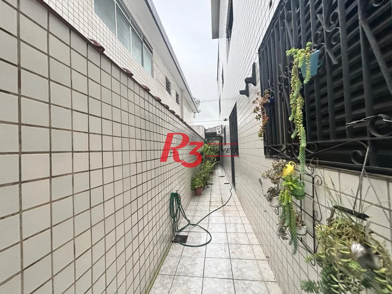 Casa com 3 dormitórios à venda, 127 m² por R$ 890.000,00 - Aparecida - Santos/SP
