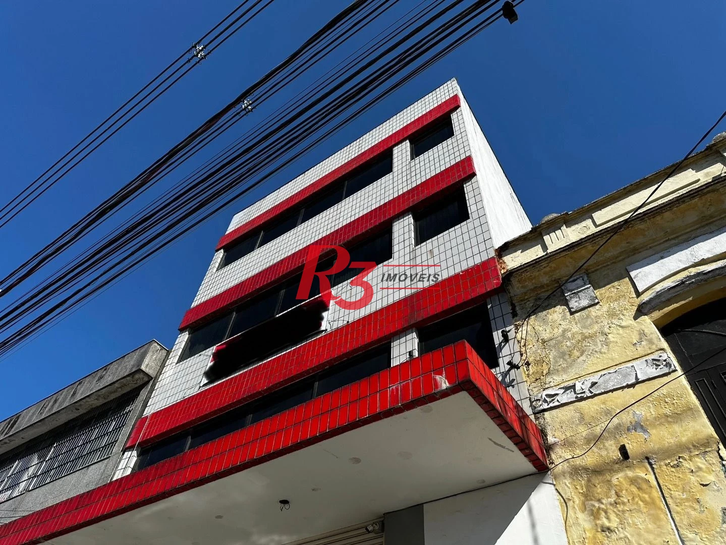 Prédio para alugar, 600 m² - Paquetá - Santos/SP