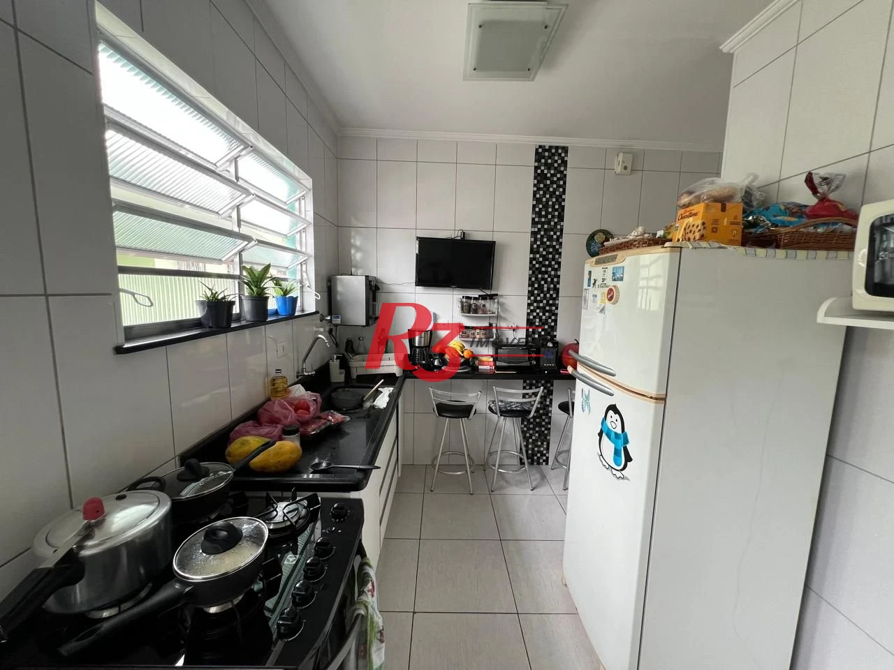 Casa com 2 dormitórios à venda, 78 m² por R$ 580.000,00 - Aparecida - Santos/SP