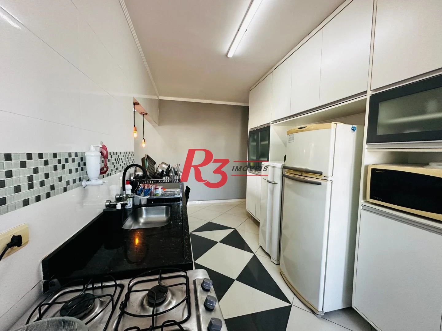 Casa com 3 dormitórios à venda, 210 m² por R$ 585.000,00 - Centro - São Vicente/SP