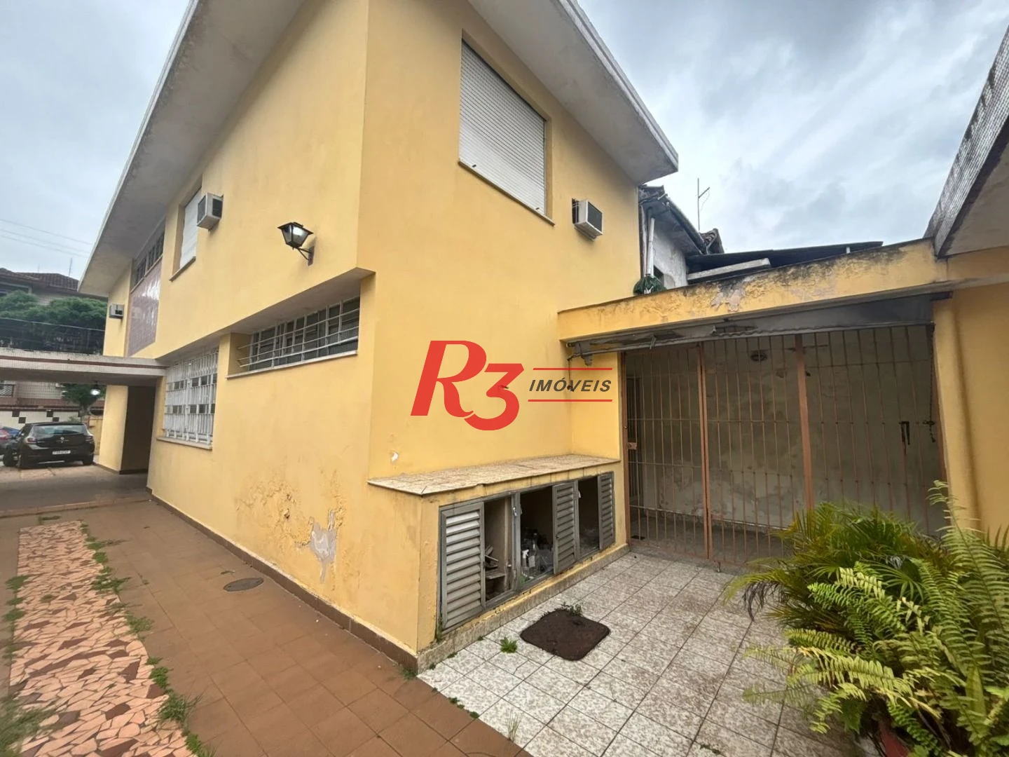 Sobrado com 3 dormitórios, 250 m² - venda por R$ 3.200.000,00 ou aluguel por R$ 24.300,01/mês - Encruzilhada - Santos/SP