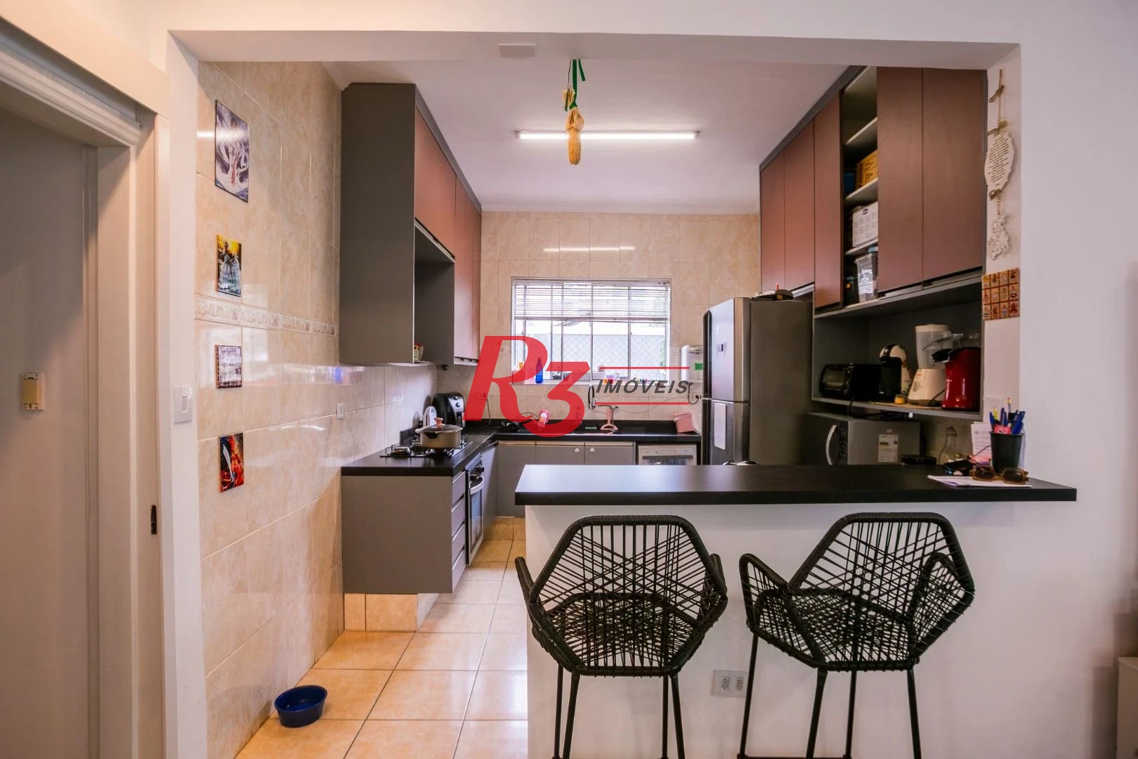Casa com 3 dormitórios à venda, 320 m² por R$ 1.750.000,00 - Gonzaga - Santos/SP