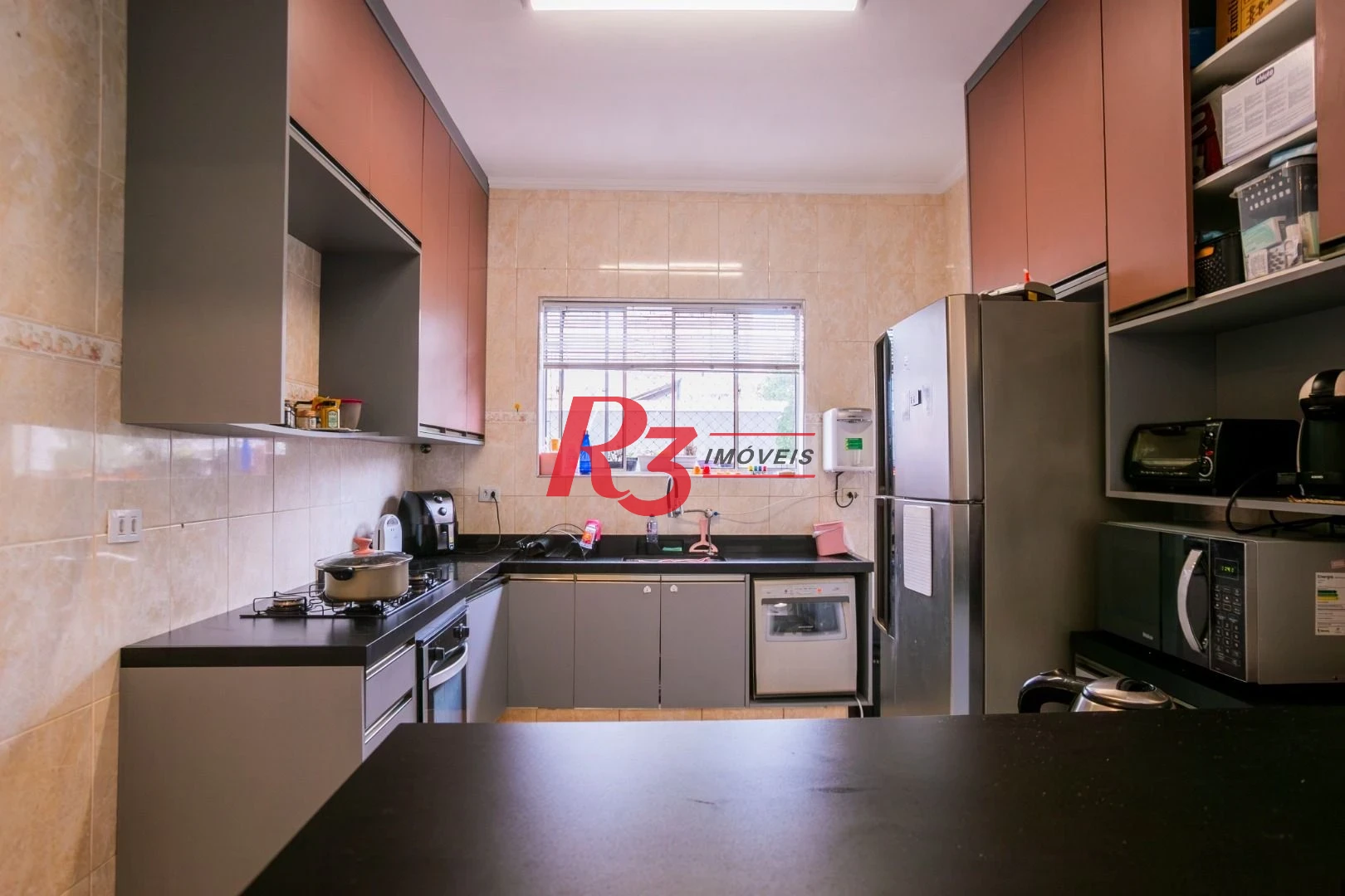 Casa com 3 dormitórios à venda, 320 m² por R$ 1.750.000,00 - Gonzaga - Santos/SP