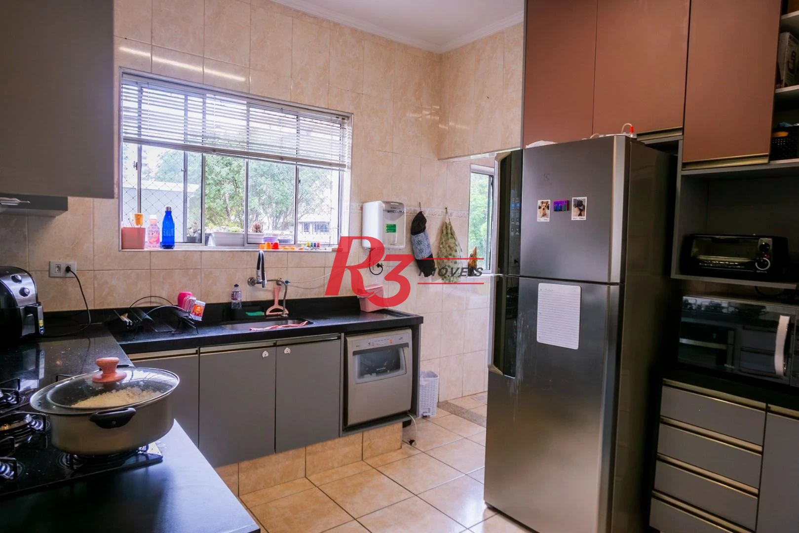 Casa com 3 dormitórios à venda, 320 m² por R$ 1.750.000,00 - Gonzaga - Santos/SP