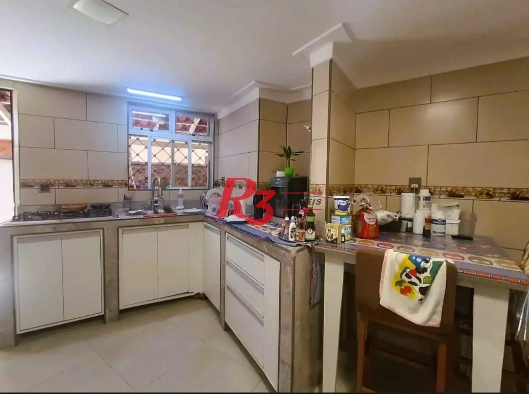 Sobrado com 3 dormitórios à venda, 114 m² por R$ 850.000,00 - Encruzilhada - Santos/SP