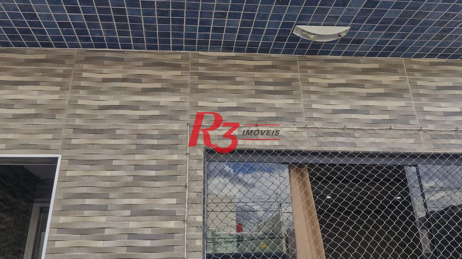 Casa com 3 dormitórios à venda, 385 m² por R$ 1.300.000,00 - Vila Guilhermina - Praia Grande/SP