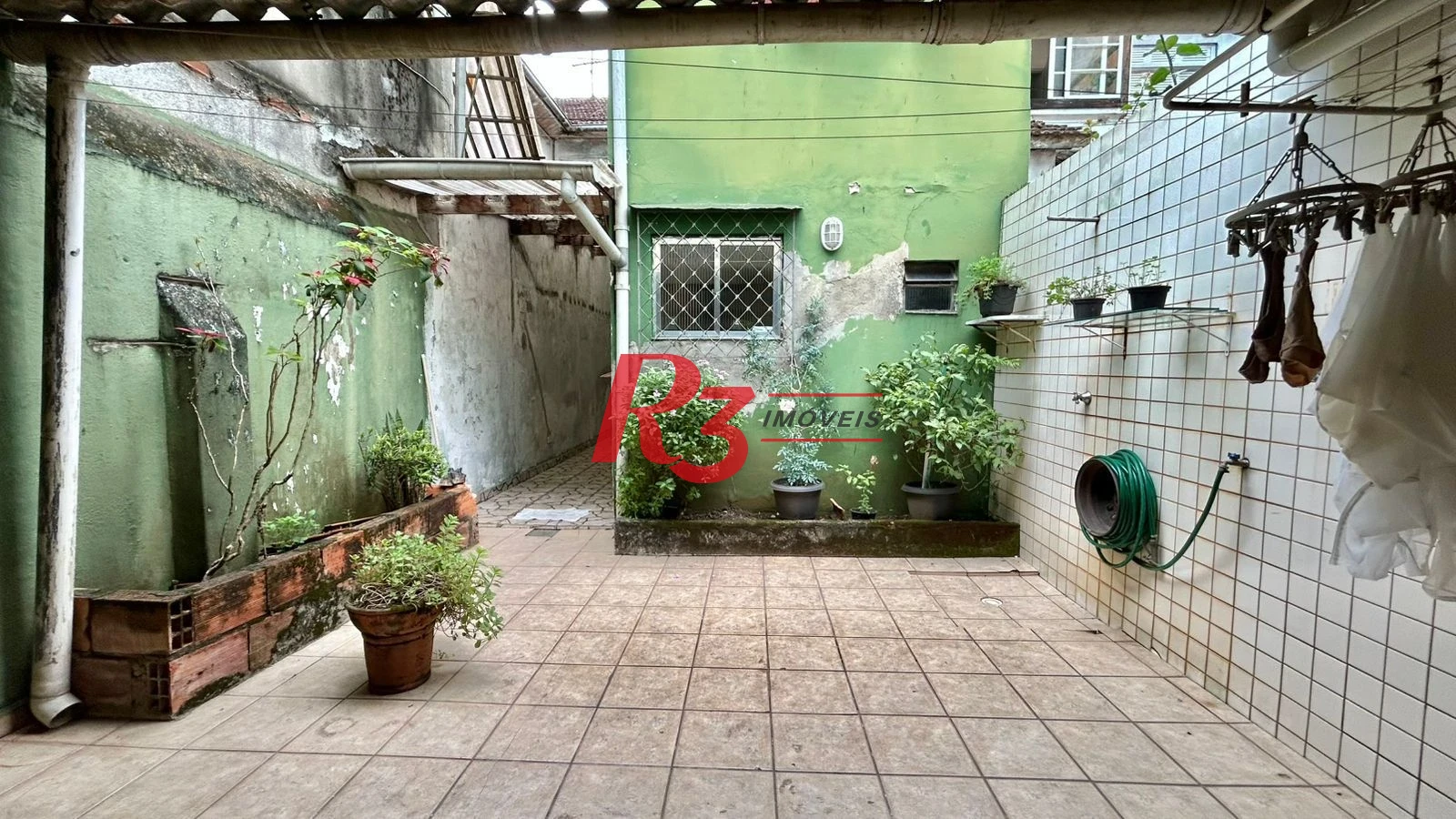 Sobrado com 3 dormitórios à venda, 121 m² por R$ 480.000,00 - Macuco - Santos/SP