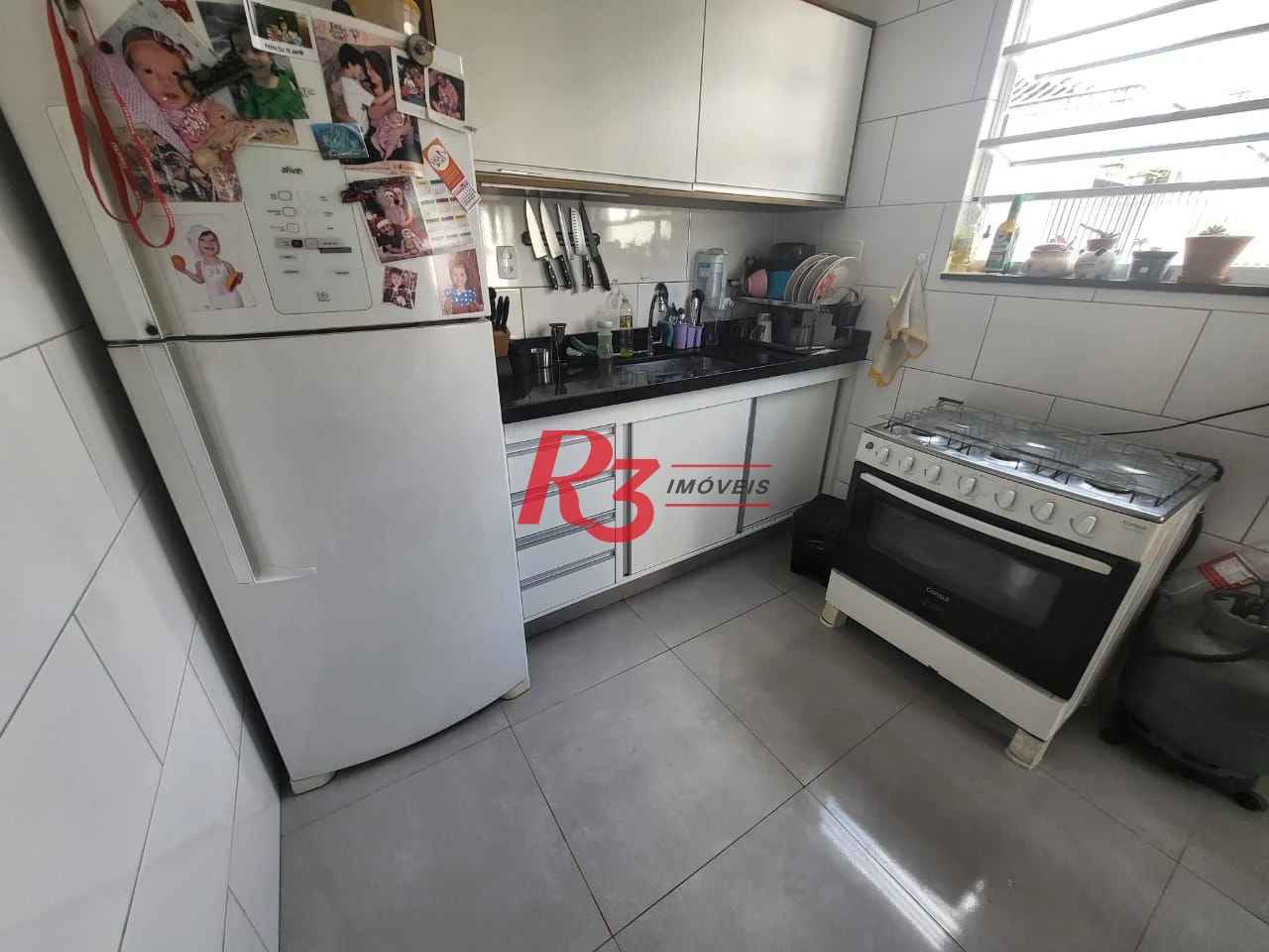 Apartamento com 2 dormitórios à venda, 65 m² por R$ 350.000,00 - Encruzilhada - Santos/SP