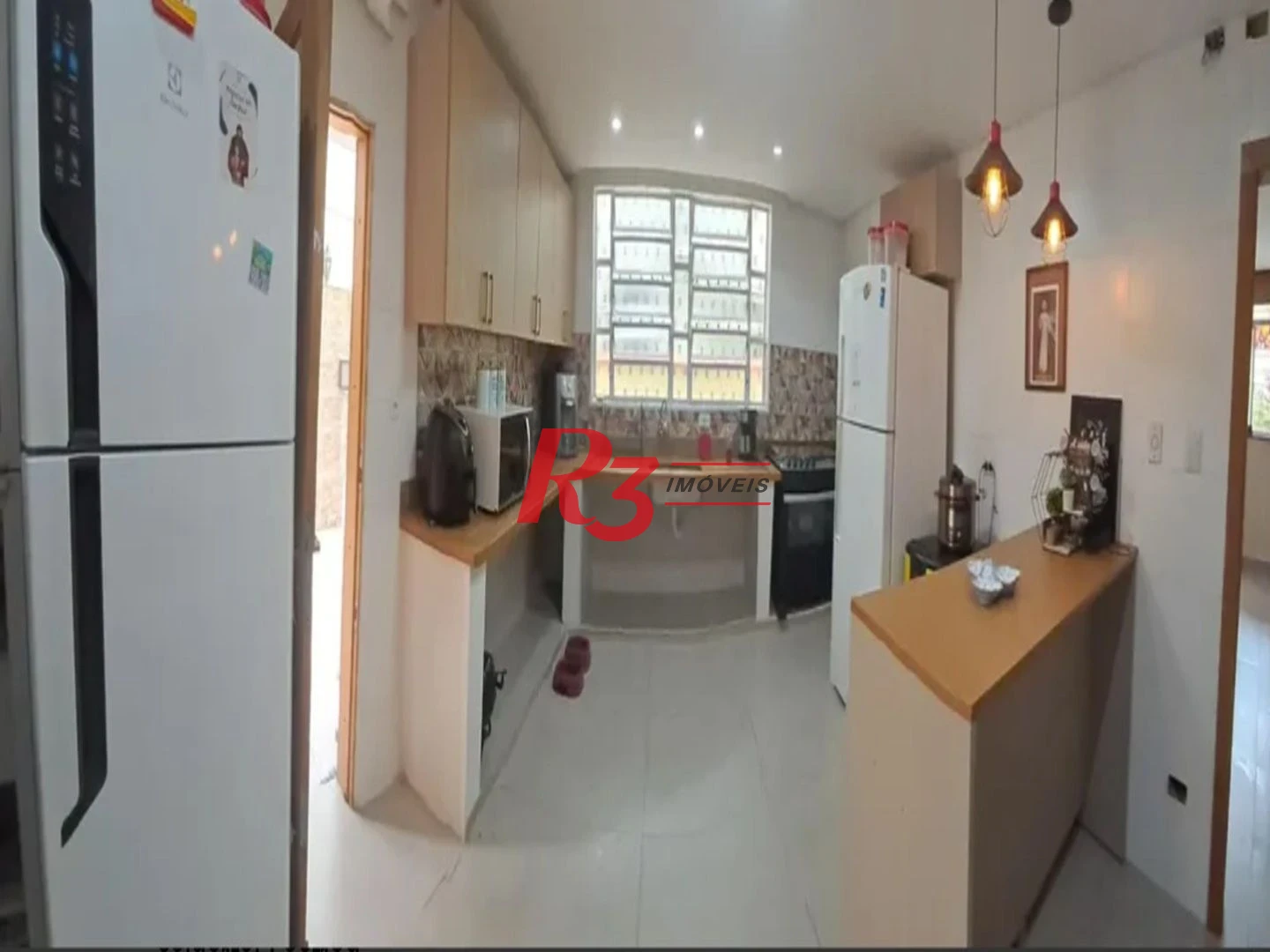 Sobrado com 3 dormitórios à venda, 134 m² por R$ 970.000,00 - Embaré - Santos/SP